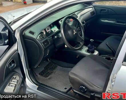 Серый Мицубиси Лансер, объемом двигателя 1.6 л и пробегом 165 тыс. км за 4000 $, фото 4 на Automoto.ua