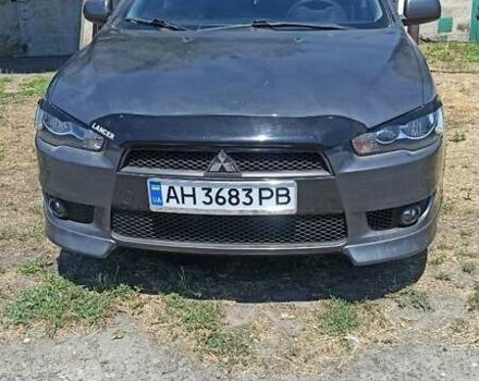Серый Мицубиси Лансер, объемом двигателя 2 л и пробегом 77 тыс. км за 9800 $, фото 1 на Automoto.ua