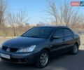 Серый Мицубиси Лансер, объемом двигателя 1.58 л и пробегом 230 тыс. км за 4600 $, фото 1 на Automoto.ua