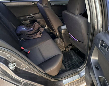 Серый Мицубиси Лансер, объемом двигателя 1.5 л и пробегом 255 тыс. км за 6000 $, фото 13 на Automoto.ua