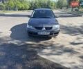 Серый Мицубиси Лансер, объемом двигателя 1.58 л и пробегом 210 тыс. км за 5000 $, фото 1 на Automoto.ua