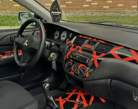 Сірий Міцубісі Lancer, об'ємом двигуна 1.6 л та пробігом 269 тис. км за 3999 $, фото 18 на Automoto.ua