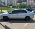 Серый Мицубиси Лансер, объемом двигателя 1.58 л и пробегом 320 тыс. км за 2950 $, фото 1 на Automoto.ua