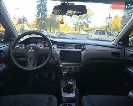 Серый Мицубиси Лансер, объемом двигателя 1.58 л и пробегом 150 тыс. км за 5200 $, фото 7 на Automoto.ua