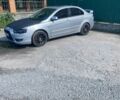 Серый Мицубиси Лансер, объемом двигателя 2 л и пробегом 253 тыс. км за 5900 $, фото 1 на Automoto.ua