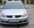 Сірий Міцубісі Lancer, об'ємом двигуна 1.6 л та пробігом 176 тис. км за 4999 $, фото 6 на Automoto.ua