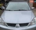 Серый Мицубиси Лансер, объемом двигателя 1.6 л и пробегом 255 тыс. км за 6100 $, фото 1 на Automoto.ua