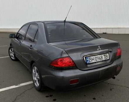 Сірий Міцубісі Lancer, об'ємом двигуна 1.58 л та пробігом 293 тис. км за 4350 $, фото 3 на Automoto.ua