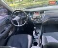 Серый Мицубиси Лансер, объемом двигателя 1.58 л и пробегом 210 тыс. км за 5000 $, фото 5 на Automoto.ua
