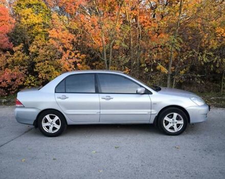 Серый Мицубиси Лансер, объемом двигателя 1.58 л и пробегом 145 тыс. км за 4800 $, фото 7 на Automoto.ua