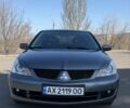 Серый Мицубиси Лансер, объемом двигателя 1.6 л и пробегом 230 тыс. км за 4600 $, фото 1 на Automoto.ua