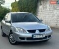 Серый Мицубиси Лансер, объемом двигателя 1.58 л и пробегом 182 тыс. км за 3900 $, фото 1 на Automoto.ua