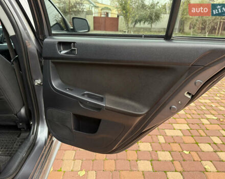 Сірий Міцубісі Lancer, об'ємом двигуна 2 л та пробігом 92 тис. км за 8200 $, фото 28 на Automoto.ua