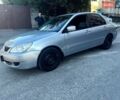 Сірий Міцубісі Lancer, об'ємом двигуна 1.6 л та пробігом 198 тис. км за 3200 $, фото 1 на Automoto.ua