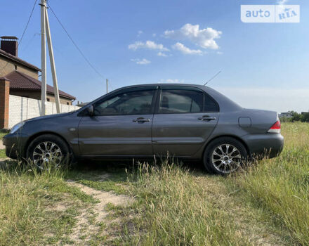 Сірий Міцубісі Lancer, об'ємом двигуна 1.6 л та пробігом 165 тис. км за 5200 $, фото 7 на Automoto.ua