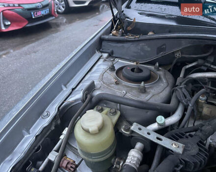 Сірий Міцубісі Lancer, об'ємом двигуна 1.58 л та пробігом 220 тис. км за 5900 $, фото 12 на Automoto.ua