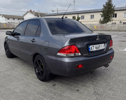 Серый Мицубиси Лансер, объемом двигателя 1.58 л и пробегом 250 тыс. км за 4300 $, фото 4 на Automoto.ua