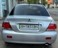 Серый Мицубиси Лансер, объемом двигателя 1.6 л и пробегом 135 тыс. км за 5700 $, фото 1 на Automoto.ua