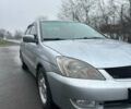 Серый Мицубиси Лансер, объемом двигателя 1.6 л и пробегом 236 тыс. км за 3800 $, фото 1 на Automoto.ua
