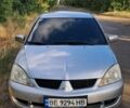 Серый Мицубиси Лансер, объемом двигателя 1.6 л и пробегом 355 тыс. км за 3710 $, фото 1 на Automoto.ua