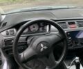 Серый Мицубиси Лансер, объемом двигателя 1.6 л и пробегом 220 тыс. км за 3500 $, фото 3 на Automoto.ua
