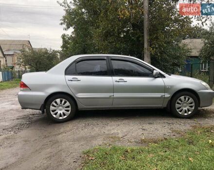 Сірий Міцубісі Lancer, об'ємом двигуна 1.58 л та пробігом 240 тис. км за 4299 $, фото 4 на Automoto.ua
