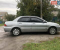 Сірий Міцубісі Lancer, об'ємом двигуна 1.58 л та пробігом 240 тис. км за 4299 $, фото 4 на Automoto.ua