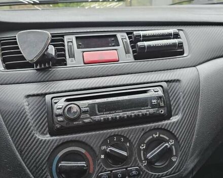 Сірий Міцубісі Lancer, об'ємом двигуна 1.58 л та пробігом 200 тис. км за 1700 $, фото 13 на Automoto.ua