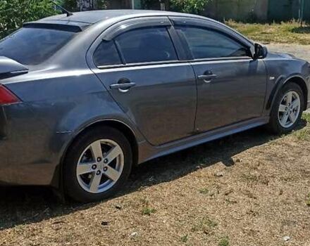 Серый Мицубиси Лансер, объемом двигателя 2 л и пробегом 77 тыс. км за 9800 $, фото 2 на Automoto.ua