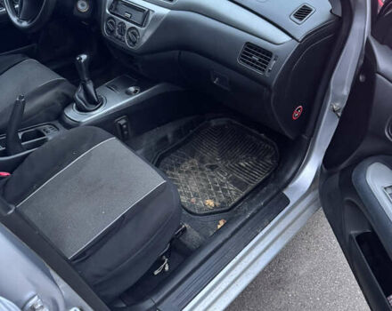 Серый Мицубиси Лансер, объемом двигателя 1.58 л и пробегом 330 тыс. км за 3500 $, фото 7 на Automoto.ua