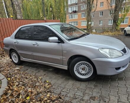 Серый Мицубиси Лансер, объемом двигателя 1.6 л и пробегом 290 тыс. км за 4800 $, фото 1 на Automoto.ua