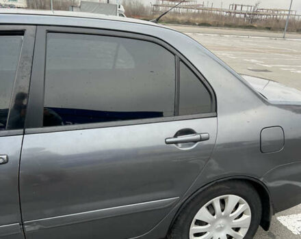 Серый Мицубиси Лансер, объемом двигателя 1.58 л и пробегом 183 тыс. км за 3800 $, фото 6 на Automoto.ua