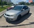 Сірий Міцубісі Lancer, об'ємом двигуна 1.58 л та пробігом 320 тис. км за 2600 $, фото 1 на Automoto.ua