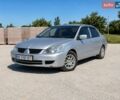 Серый Мицубиси Лансер, объемом двигателя 1.58 л и пробегом 190 тыс. км за 3500 $, фото 1 на Automoto.ua