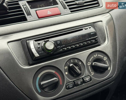 Сірий Міцубісі Lancer, об'ємом двигуна 1.6 л та пробігом 221 тис. км за 3650 $, фото 20 на Automoto.ua