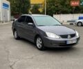 Серый Мицубиси Лансер, объемом двигателя 1.58 л и пробегом 209 тыс. км за 3900 $, фото 1 на Automoto.ua