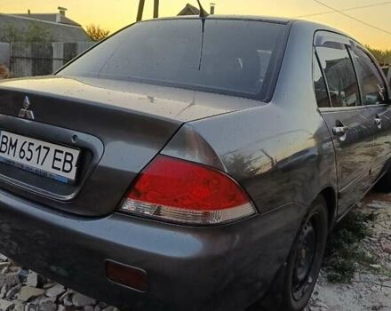 Серый Мицубиси Лансер, объемом двигателя 1.6 л и пробегом 234 тыс. км за 4300 $, фото 2 на Automoto.ua
