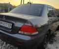 Серый Мицубиси Лансер, объемом двигателя 1.6 л и пробегом 234 тыс. км за 4300 $, фото 2 на Automoto.ua