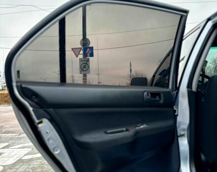 Серый Мицубиси Лансер, объемом двигателя 1.6 л и пробегом 165 тыс. км за 4000 $, фото 9 на Automoto.ua