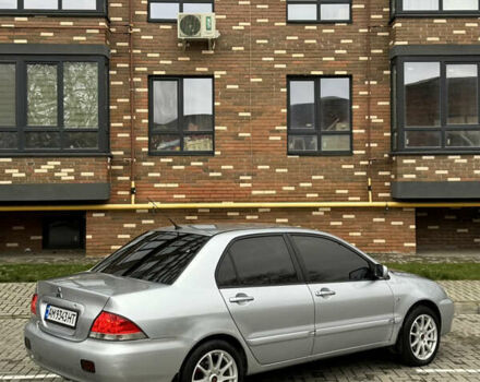 Сірий Міцубісі Lancer, об'ємом двигуна 1.6 л та пробігом 269 тис. км за 3999 $, фото 12 на Automoto.ua