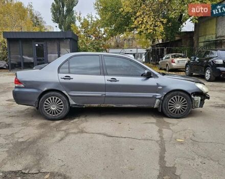 Сірий Міцубісі Lancer, об'ємом двигуна 1.58 л та пробігом 200 тис. км за 1700 $, фото 10 на Automoto.ua