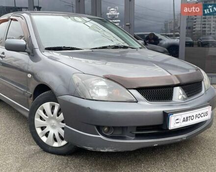 Серый Мицубиси Лансер, объемом двигателя 1.58 л и пробегом 146 тыс. км за 5490 $, фото 1 на Automoto.ua