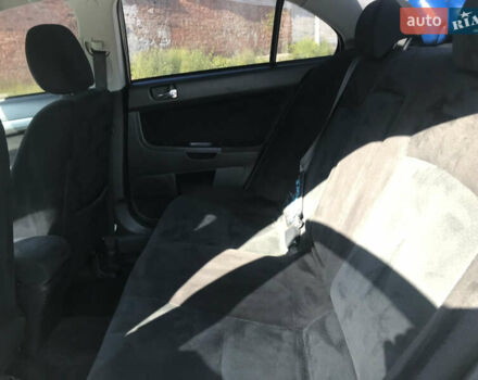 Серый Мицубиси Лансер, объемом двигателя 2 л и пробегом 256 тыс. км за 7000 $, фото 6 на Automoto.ua