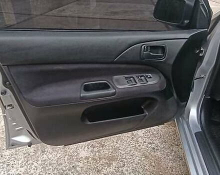 Сірий Міцубісі Lancer, об'ємом двигуна 1.6 л та пробігом 176 тис. км за 4999 $, фото 28 на Automoto.ua