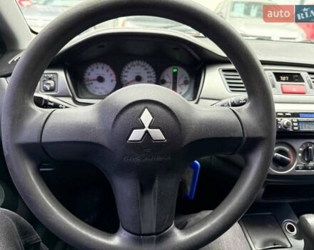 Сірий Міцубісі Lancer, об'ємом двигуна 1.6 л та пробігом 206 тис. км за 4799 $, фото 12 на Automoto.ua