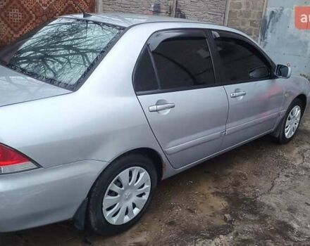 Серый Мицубиси Лансер, объемом двигателя 1.6 л и пробегом 320 тыс. км за 4167 $, фото 2 на Automoto.ua