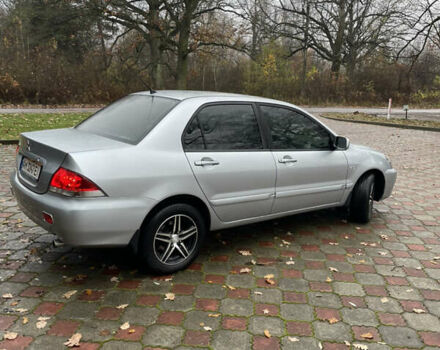 Сірий Міцубісі Lancer, об'ємом двигуна 1.59 л та пробігом 219 тис. км за 4500 $, фото 5 на Automoto.ua