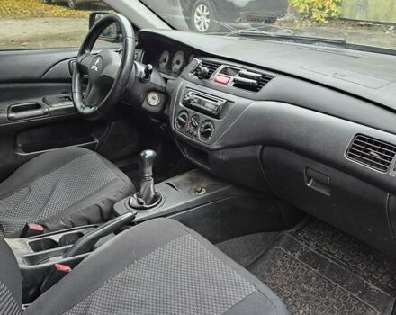 Сірий Міцубісі Lancer, об'ємом двигуна 1.58 л та пробігом 200 тис. км за 1700 $, фото 11 на Automoto.ua
