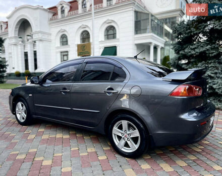 Серый Мицубиси Лансер, объемом двигателя 2 л и пробегом 212 тыс. км за 6000 $, фото 5 на Automoto.ua