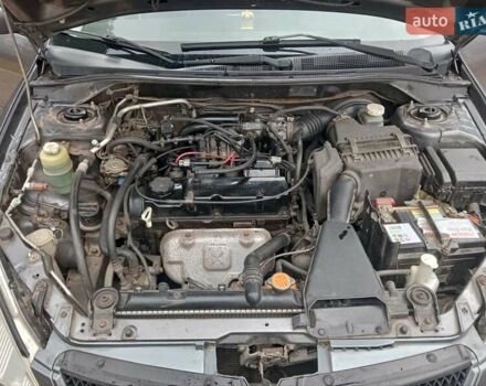 Серый Мицубиси Лансер, объемом двигателя 1.58 л и пробегом 205 тыс. км за 3300 $, фото 11 на Automoto.ua